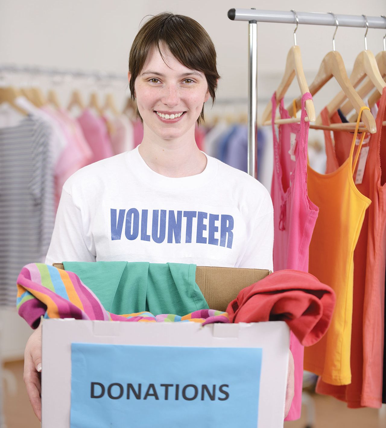 Volunteer with clothes donation box
